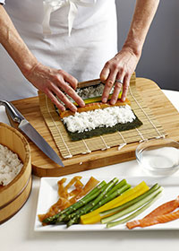 pick up the edge of the sushi mat